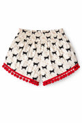 Cream shorts with black cat print, floral details, and red pom-pom trim