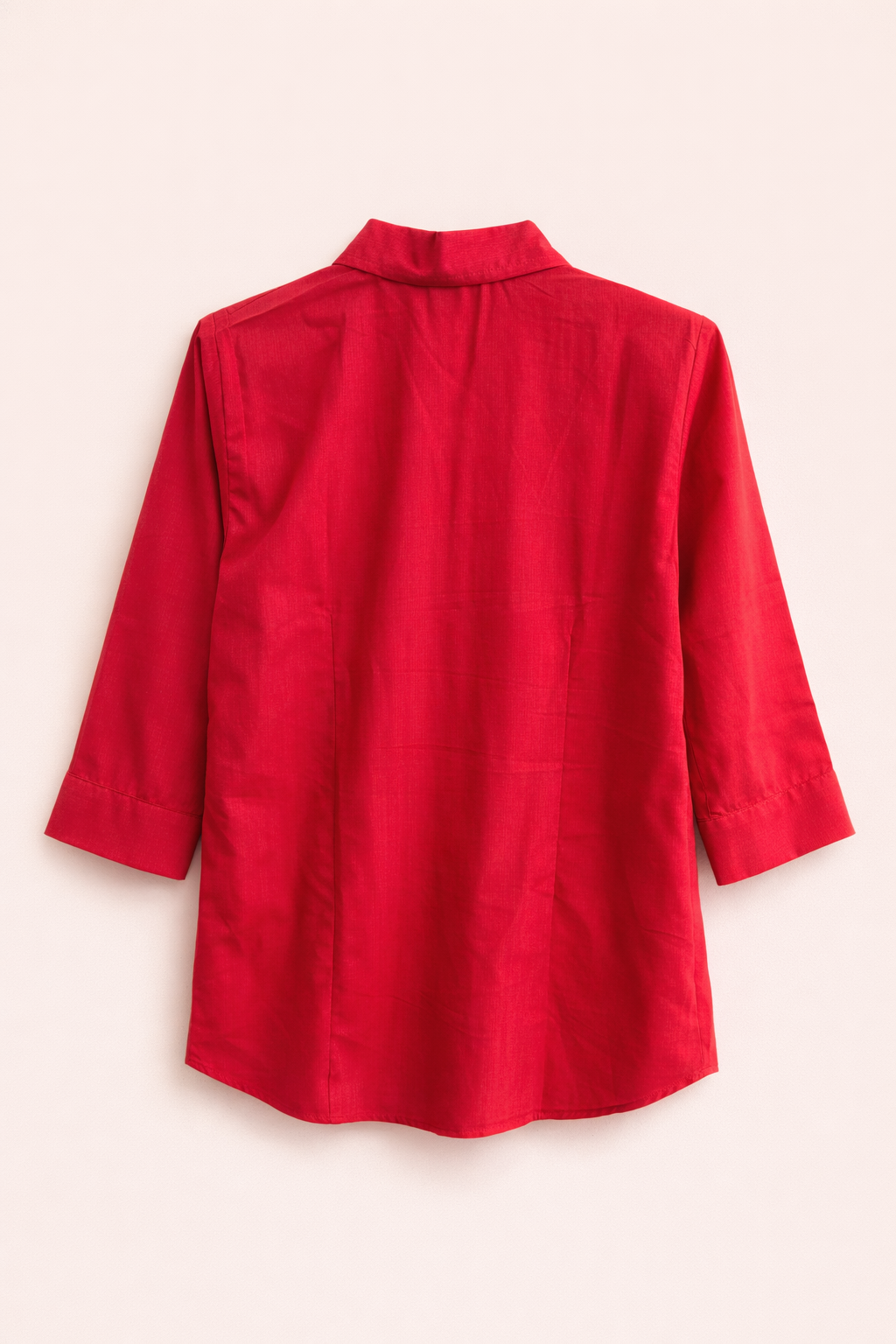 Red shirt on a light pink background