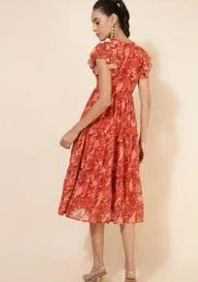 Woman wearing red floral midi dress with short sleeves, stylish casual fashion